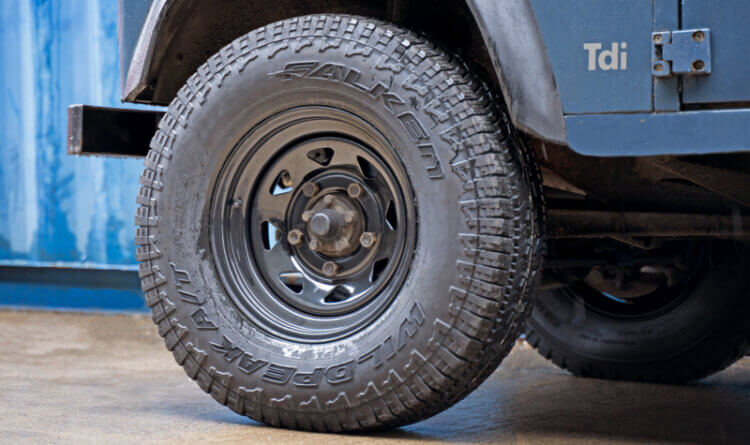 Classic blue land rover on defender steel wheels tuff torque wheels