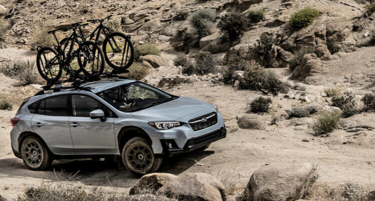A SUV car offloading over rocky terrain sat on Falken Azenis SUV tyres